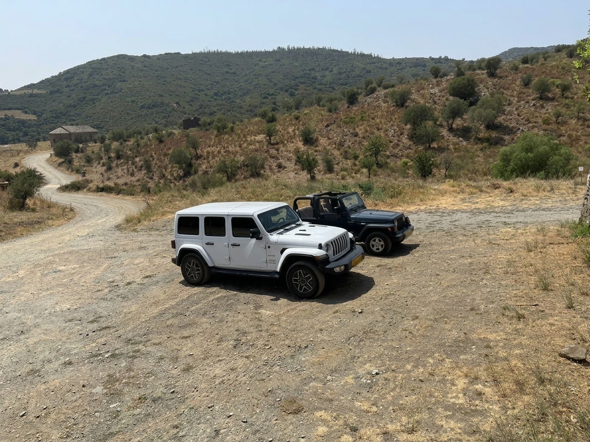 The two Jeeps on the road in the hills behind the coast